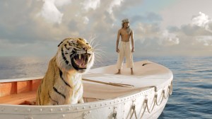 Pi Patel (Suraj Sharma) and a fierce Bengal tiger named Richard Parker are forced to share a lifeboat in director Ang Lee’s “Life of Pi.” 