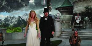Michelle Williams, far left, plays Glinda and James Franco (by her side) plays the title character in “Oz the Great and Powerful.” 