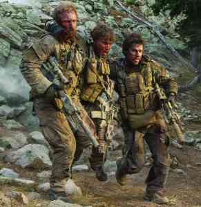 From left to right, Ben Foster, Emile Hirsch and Mark Wahlberg play US Navy SEALs in “Lone Survivor.” 